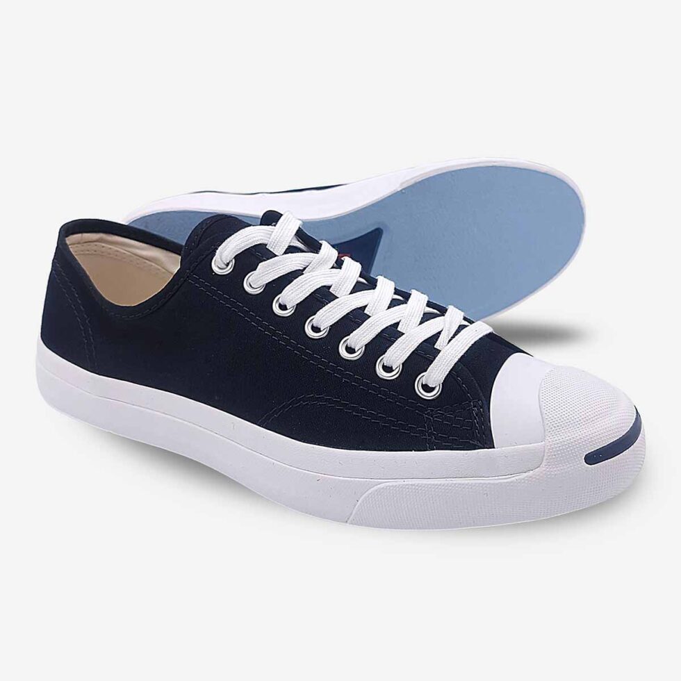 Side-bottom angle of Jack Purcell low black canvas sneaker showing blue rubber sole