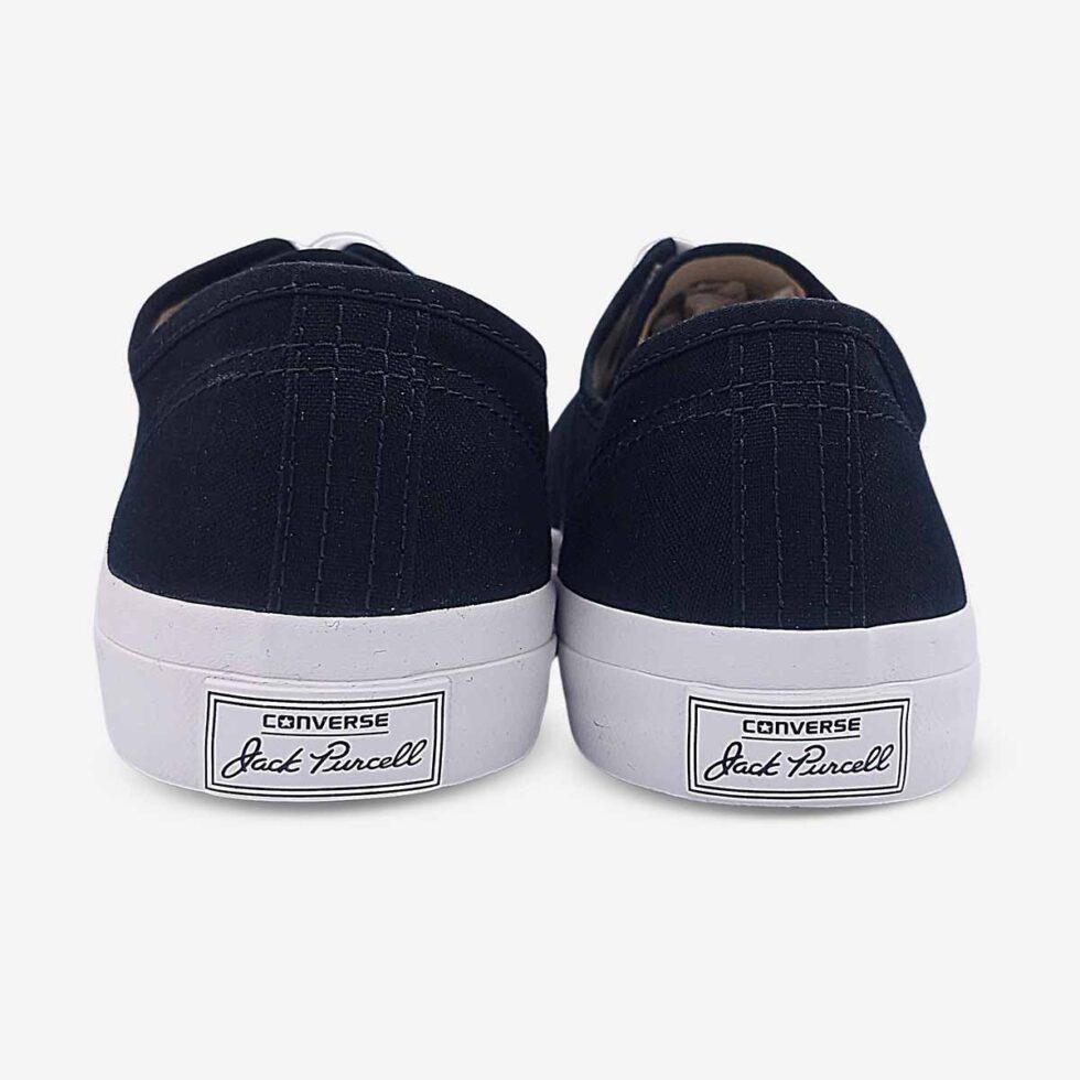 Back view of Jack Purcell black canvas sneaker showing heel branding and blue sole