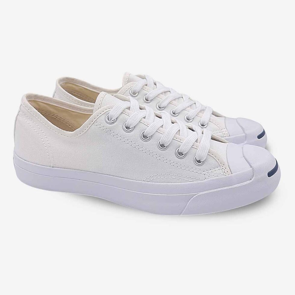Angled pair of Jack Purcell low white canvas sneakers with blue sole for men