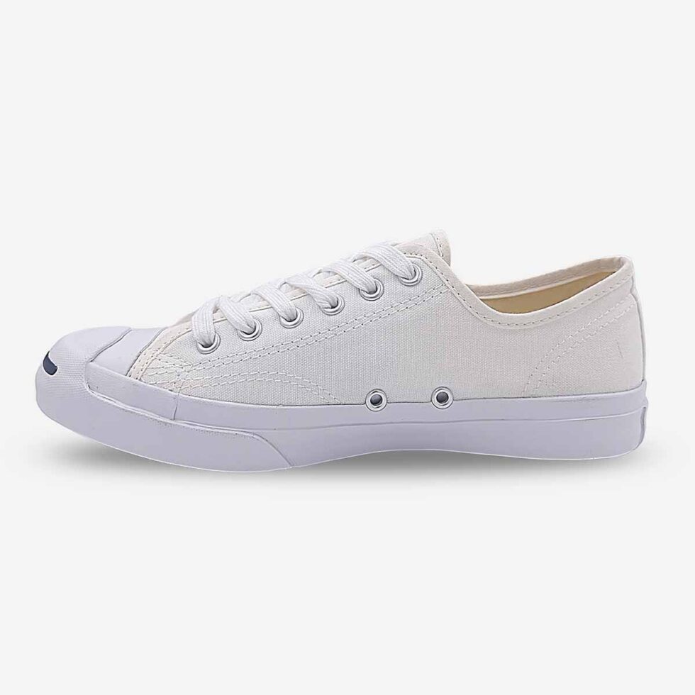 Inner side of Jack Purcell low white canvas sneaker with lace-up front and blue sole