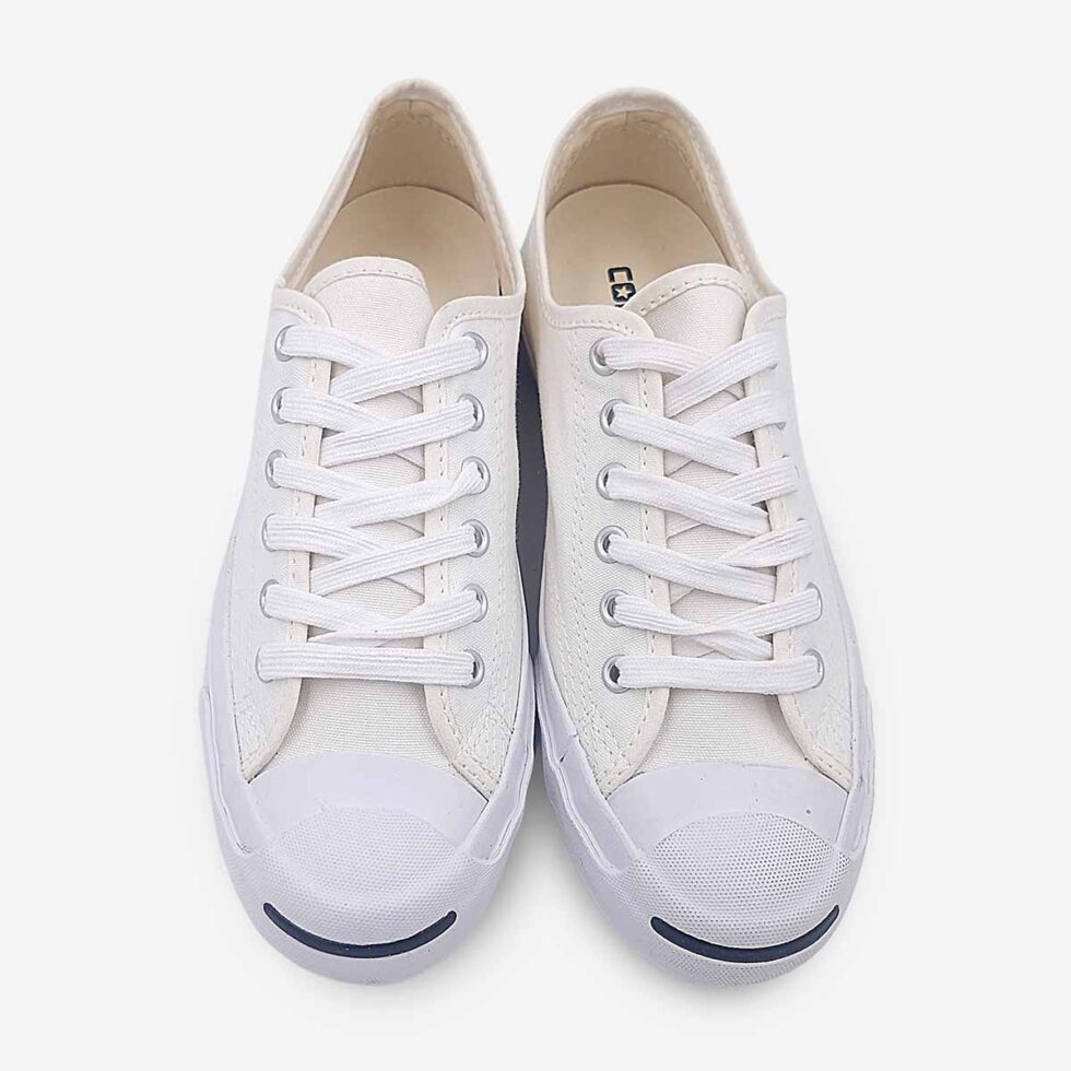 Top view of Jack Purcell low white canvas sneaker with blue sole showing lace-up closure