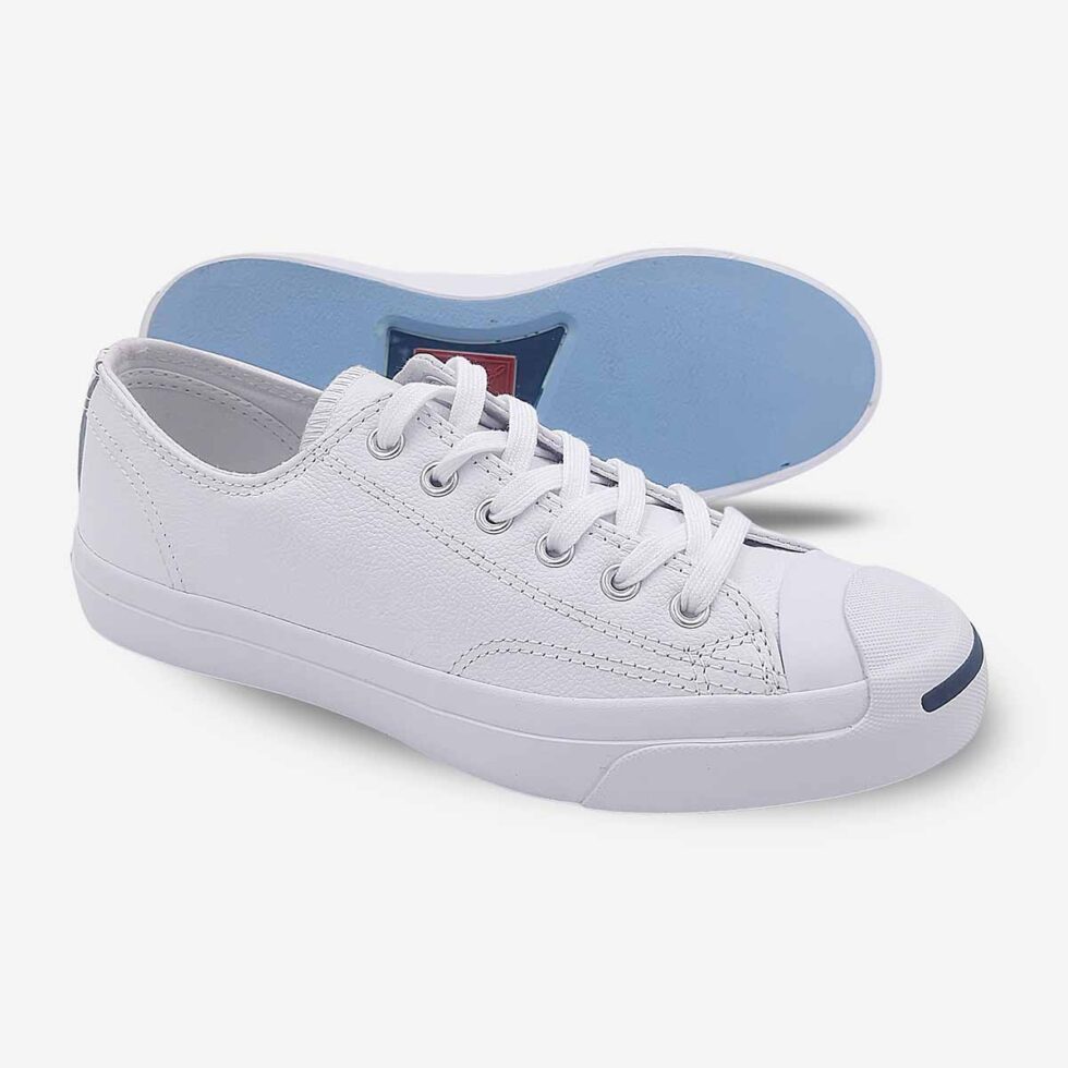 Side-bottom angle of Jack Purcell low white leather sneaker showing blue sole underneath