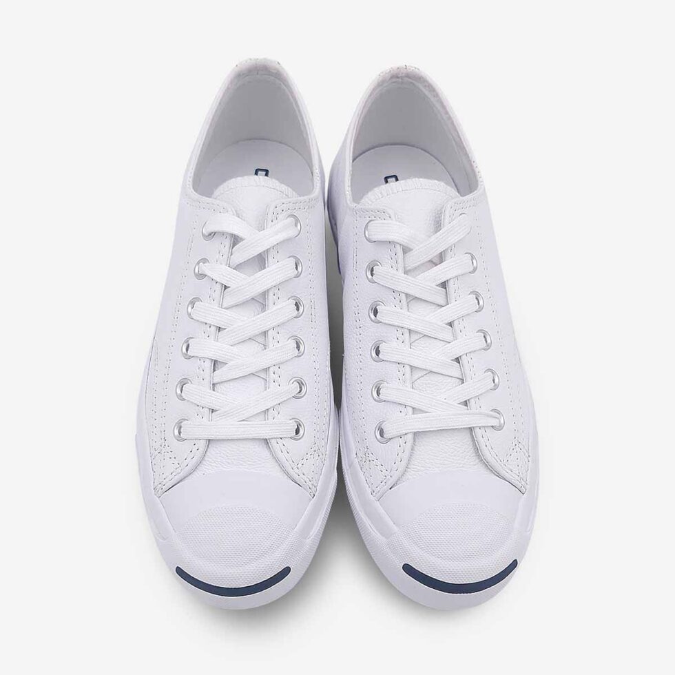 Top view of Jack Purcell low white leather sneaker in white showing lace-up closure