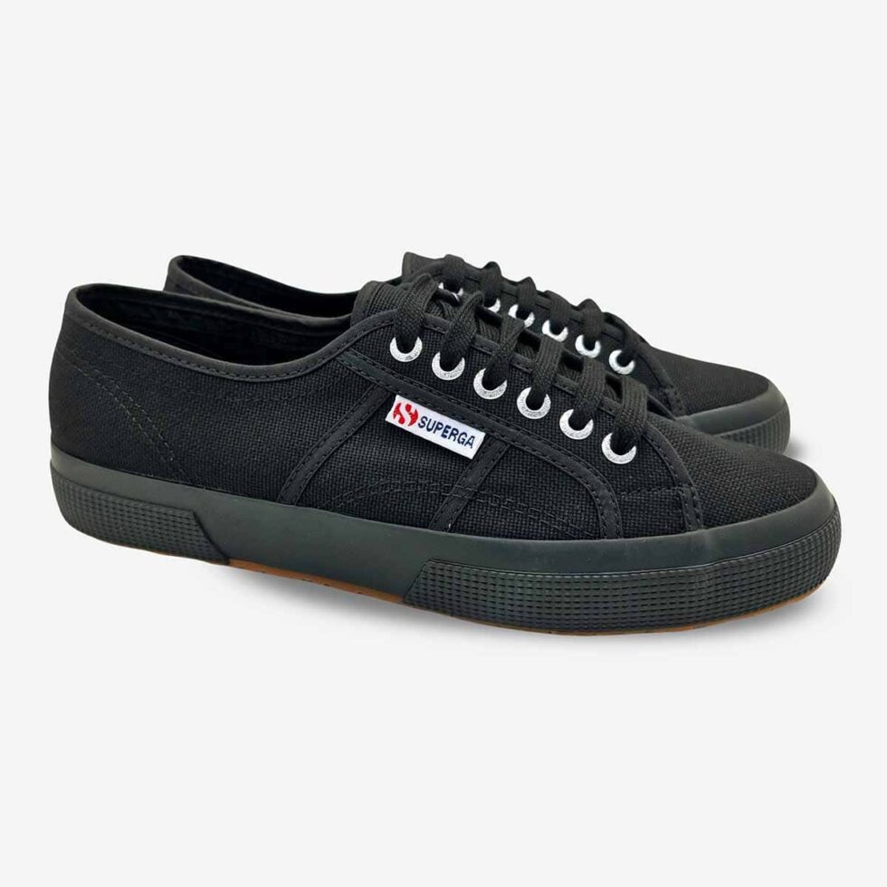 Pair of Superga 2750 Cotu full black sneakers, angled view showing front and side profile