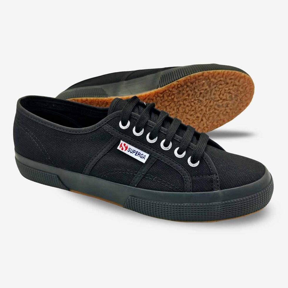 Full black Superga 2750 Cotu sneakers, angled pair showing vulcanized rubber sole and cotton upper