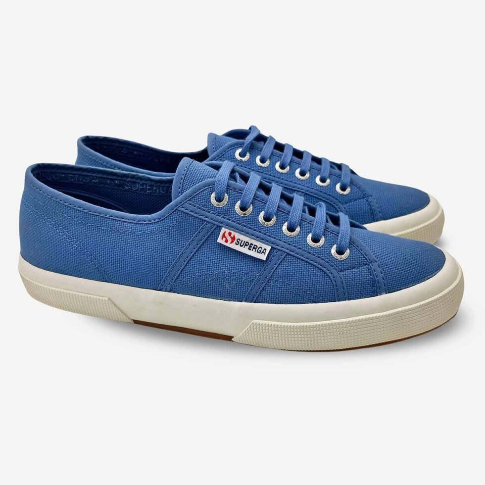 Pair of Superga 2750 Cotu low-cut sneakers in light blue, angled view showing front and side