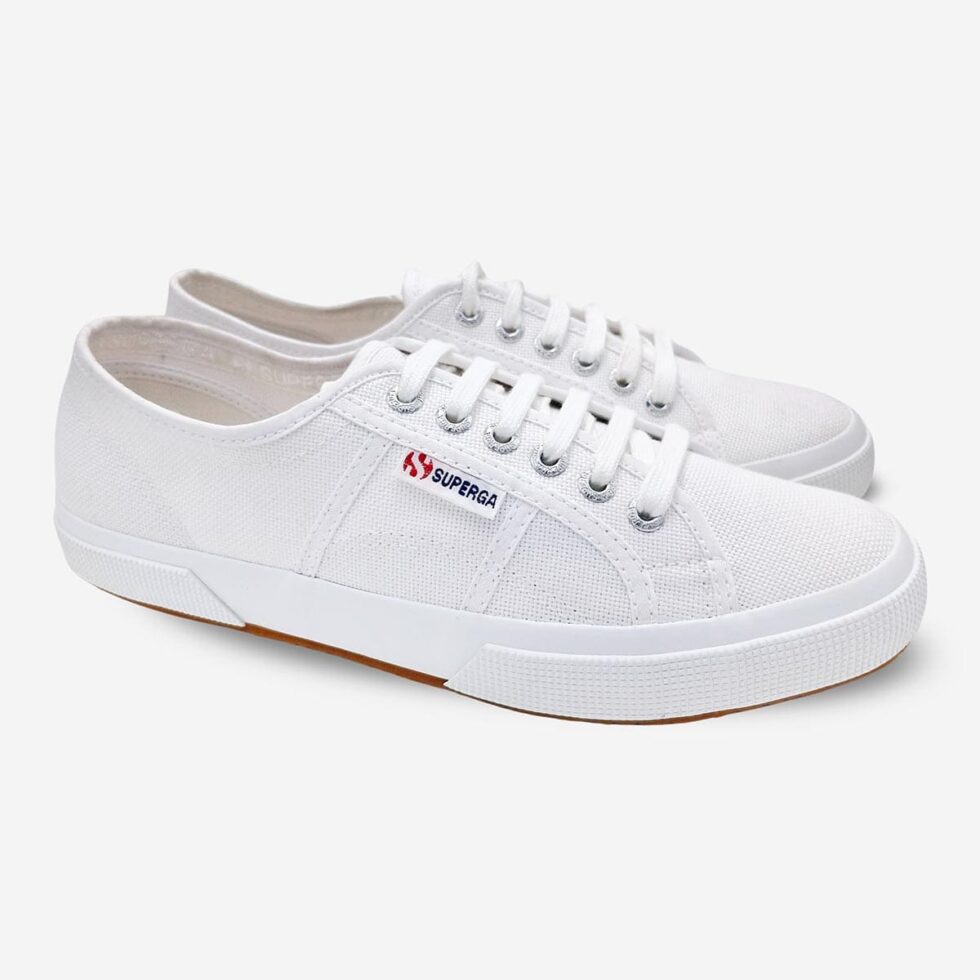 Pair of Superga 2750 Cotu white low-cut sneakers, angled view showing front and side profile