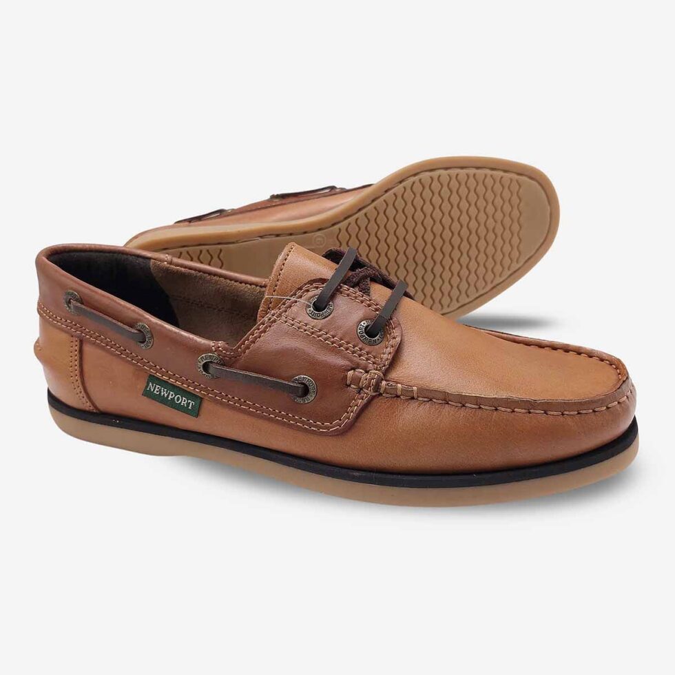 A pair of Newport Firstmate Santiago Shoes in Biscuit Mid Brown Colour with a Brown Sole, shown in an angled and sole view — one shoe angled upright, the other laid on its side to reveal the sole.