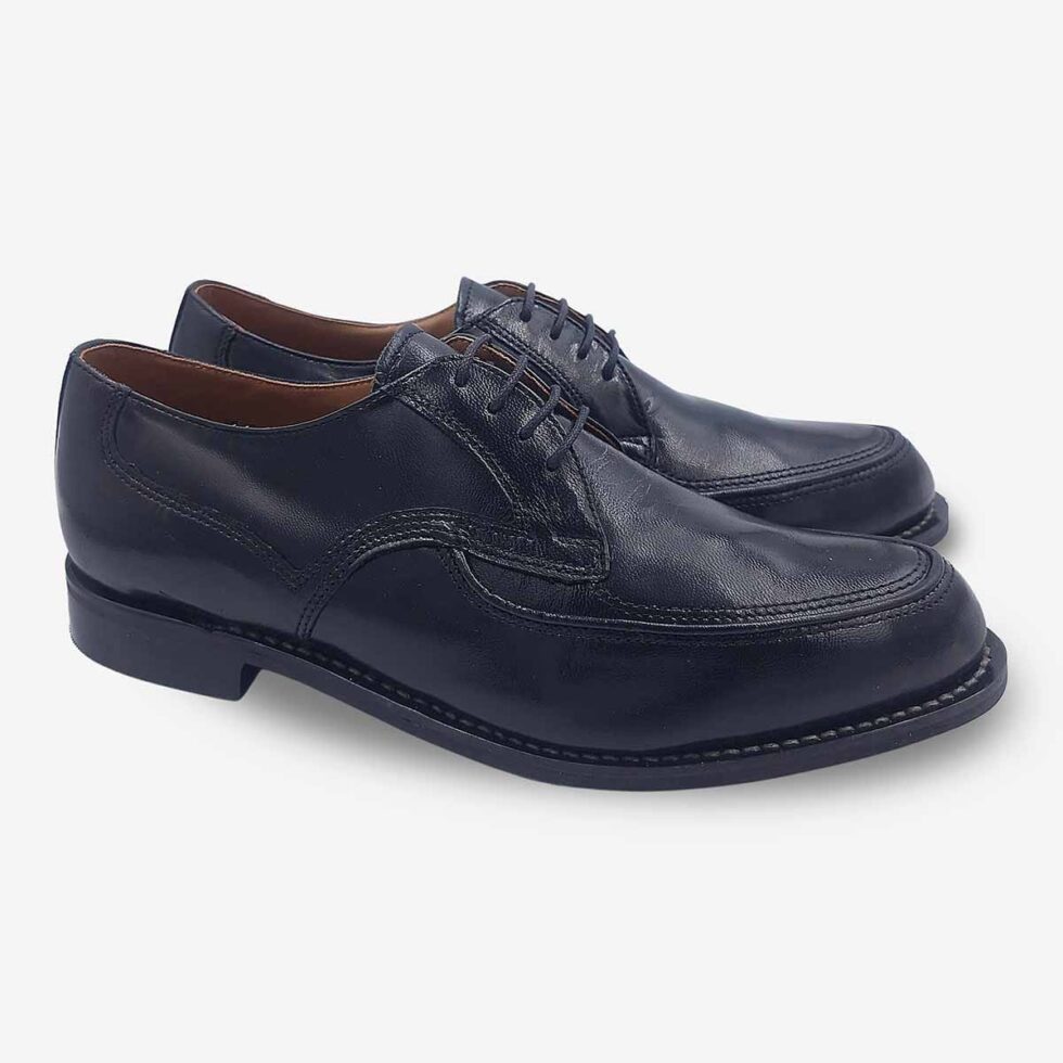 Angled pair view of Bishop black textured leather Derby shoes.