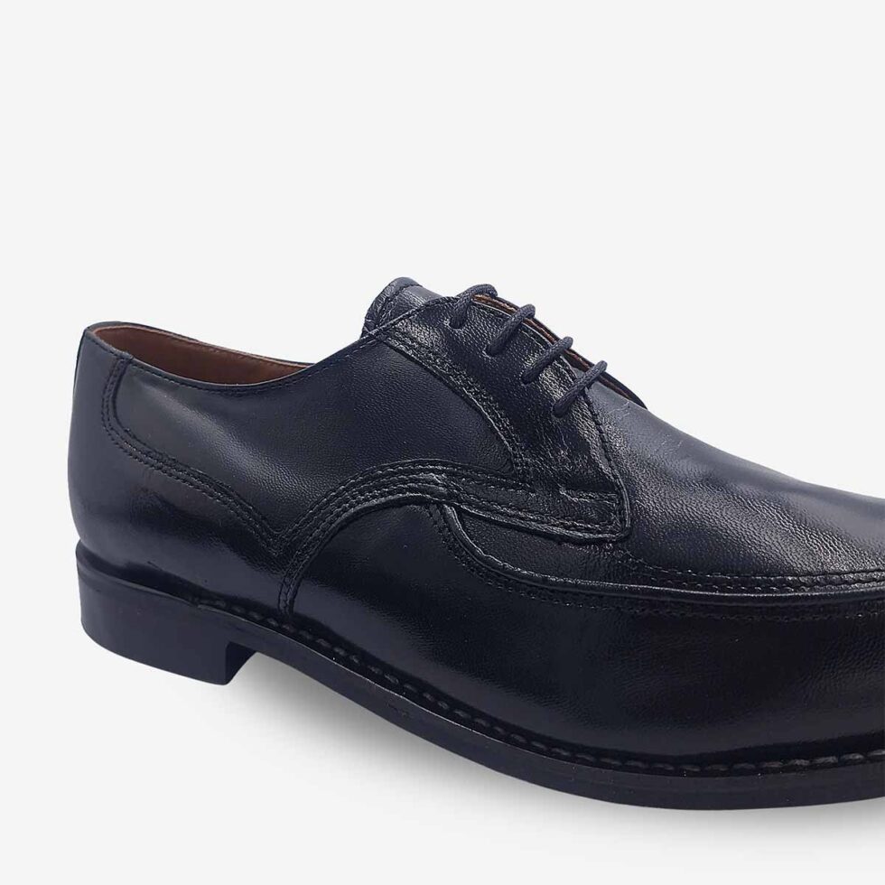 Up close view of Bishop black textured leather Derby shoes.