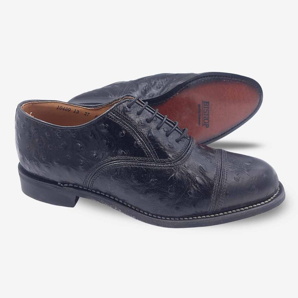 Angled pair with sole view of Bishop Oxford shoes in genuine black leather with ostrich print cap toe.