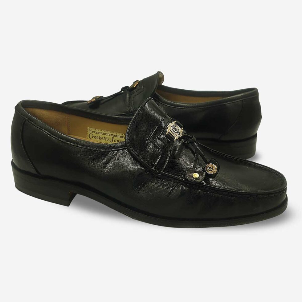 Mirrored view of Crockett & Jones Glace Kid Black tassel loafers