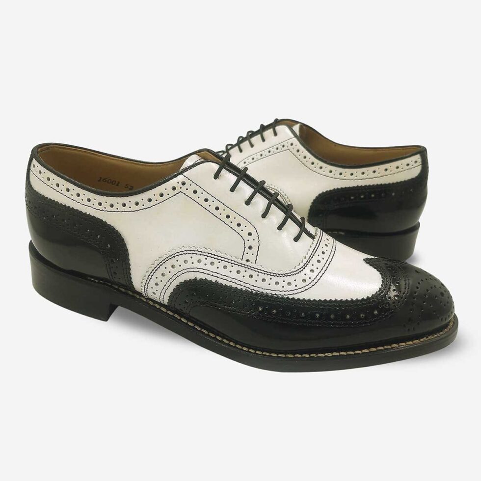 Mirrored view of Johnston & Murphy black and white wingtip brogue shoes