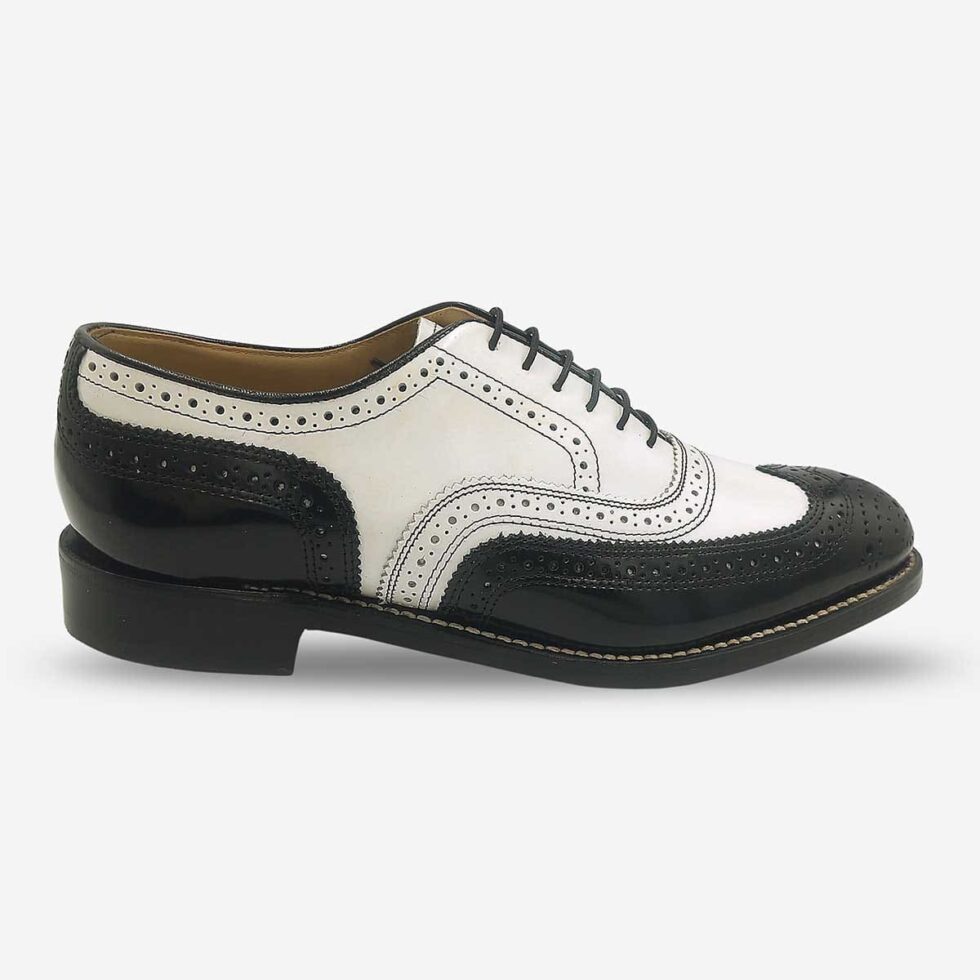 Side front view of Johnston & Murphy black and white oxford wingtip