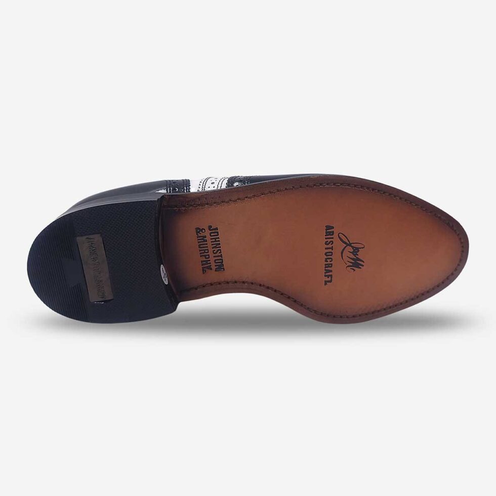 Undersole of Johnston & Murphy black and white oxford wingtip shoes