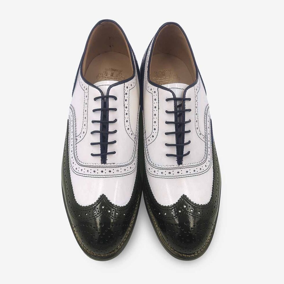 Overhead view of Johnston & Murphy black and white oxford with wingtip perforations