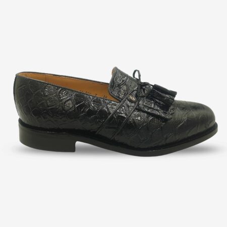 Side front view of Johnston & Murphy black croc-embossed tassel loafer