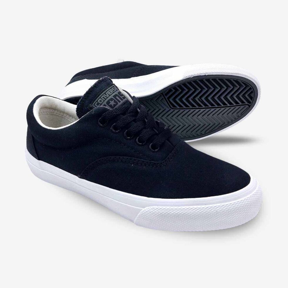 Angled pair of Converse Skidgrip black canvas sneakers showing textured rubber sole