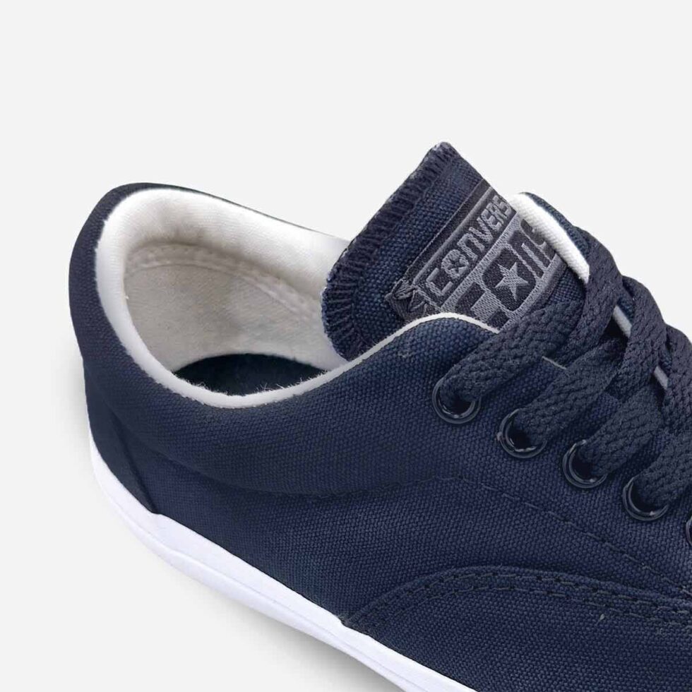 Close-up of Converse Skidgrip low-cut sneaker in black canvas with visible stitch detailing