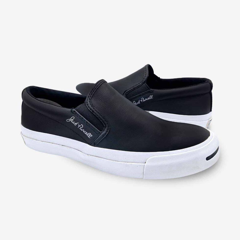 Mirrored pair of Jack Purcell men’s leather slip-on sneakers in black colour