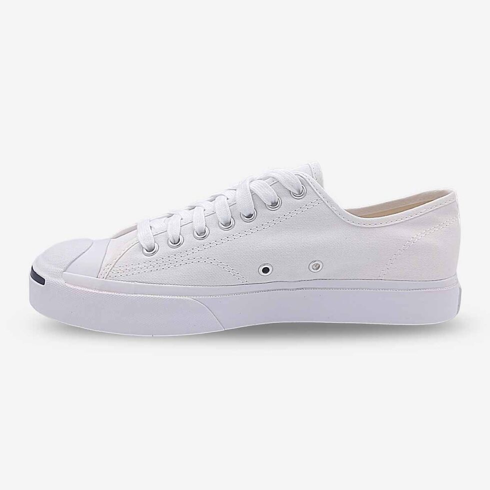 Inner side of Jack Purcell low white canvas sneaker with lace-up closure and clean white finish