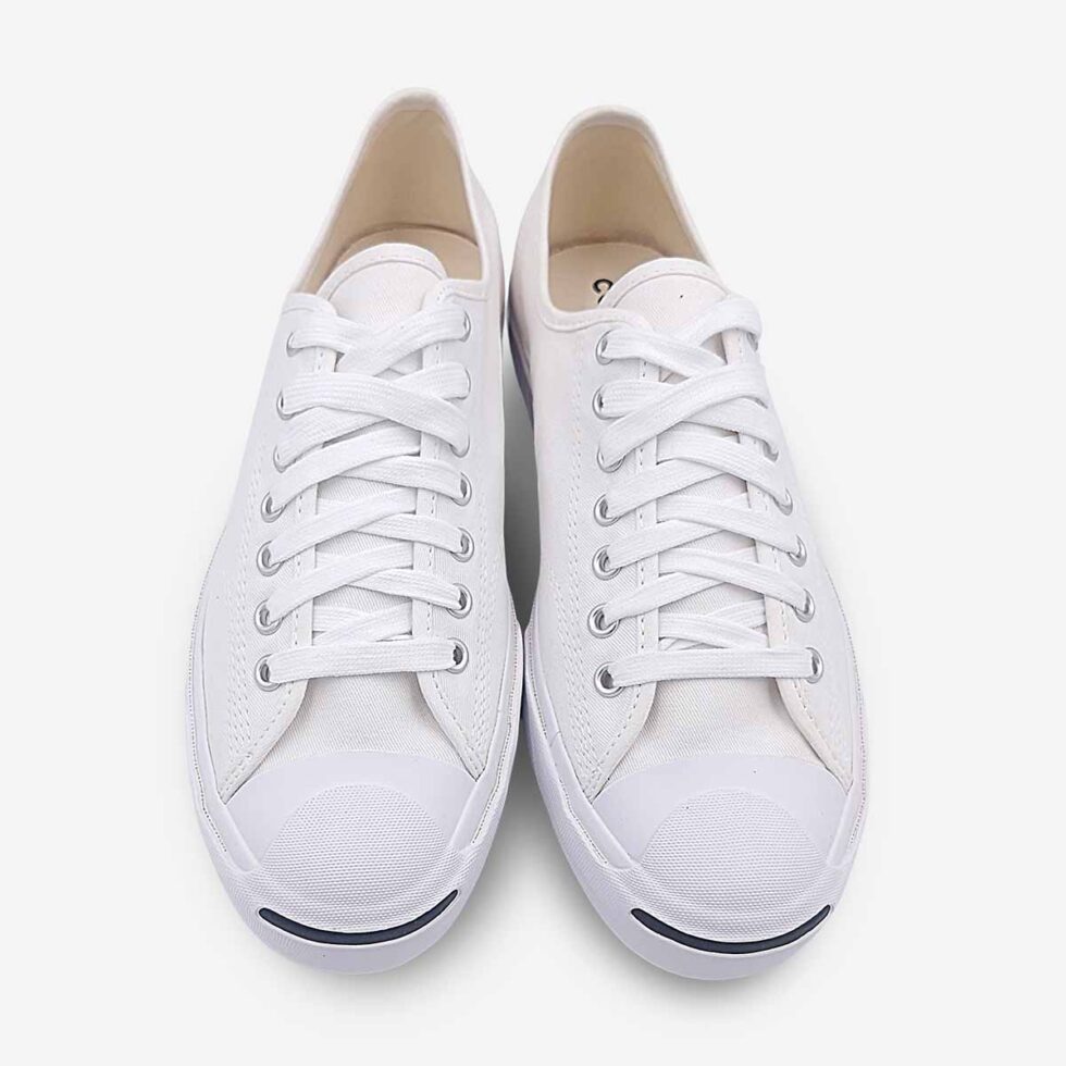 Top view of Jack Purcell low white canvas sneaker showing lace-up closure and stitch detailing