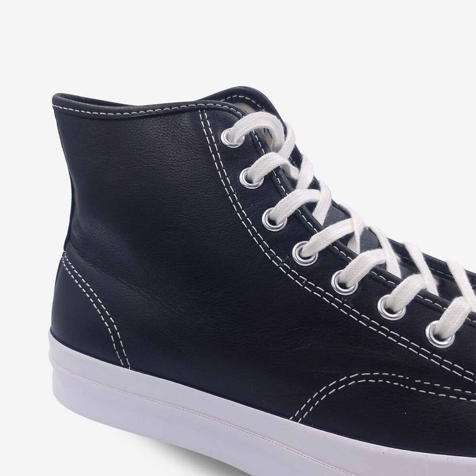 Close-up of Jack Purcell signature black leather high-top boot with smooth leather and stitching