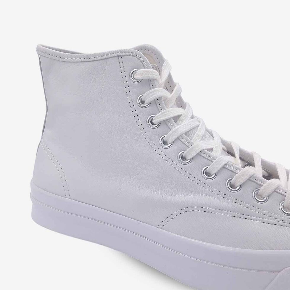 Close-up of Jack Purcell signature white leather boot showing smooth leather and stitch detailing