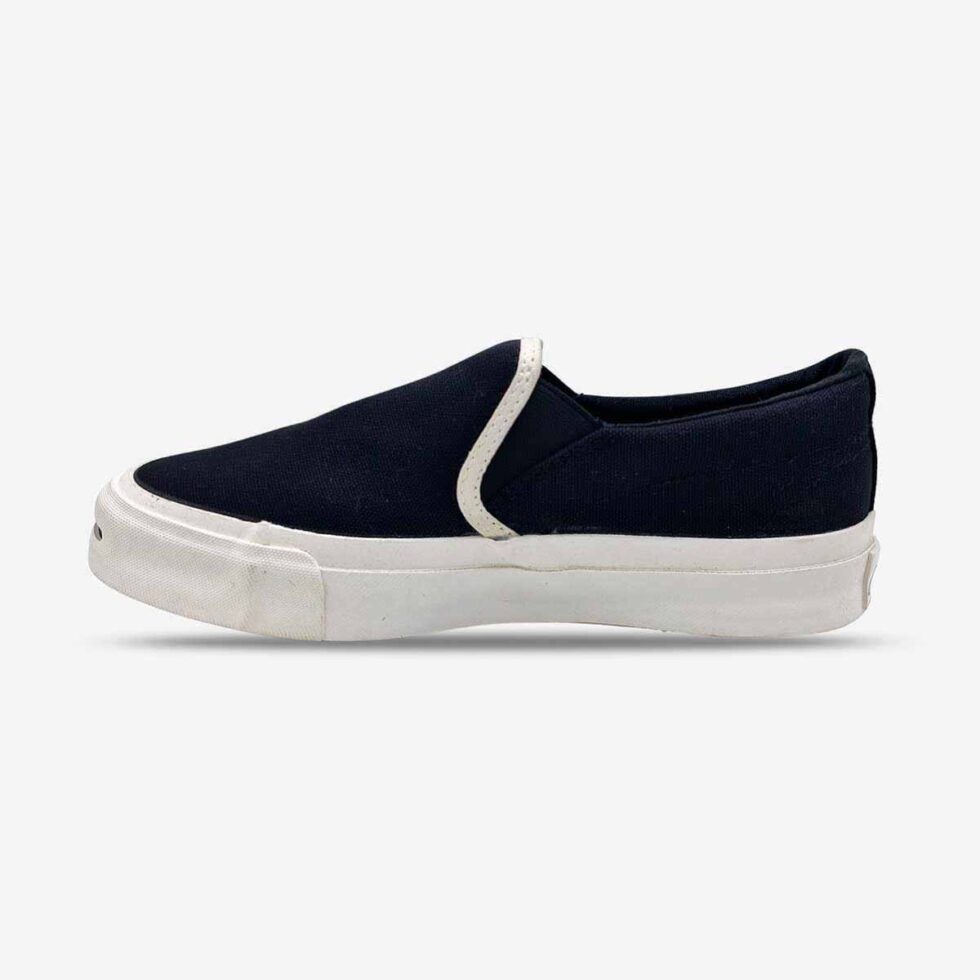 Inner side of Jack Purcell youth slip-on sneaker in black canvas