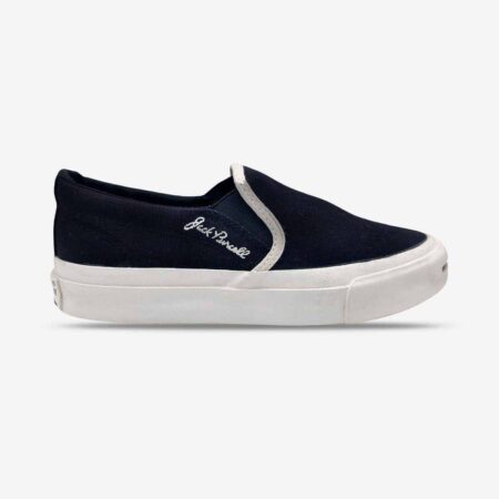 Side-front view of Jack Purcell youth black canvas slip-on sneaker