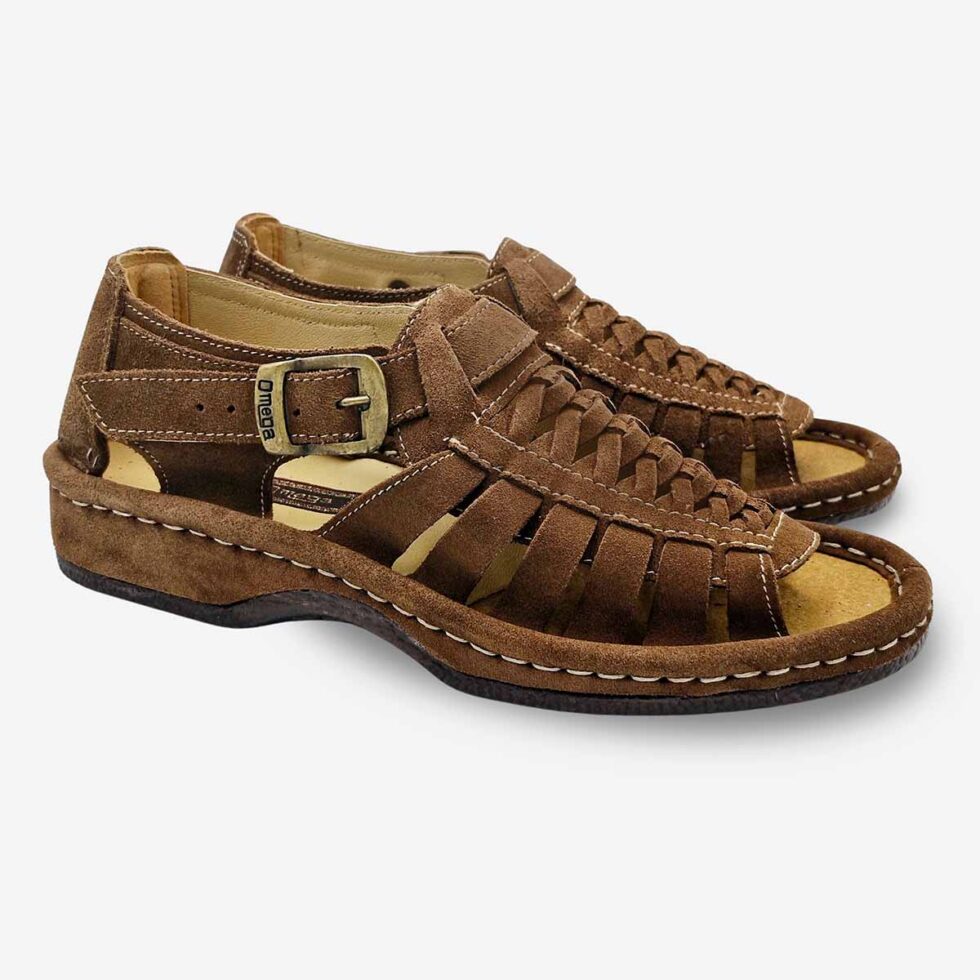 Angled pair view of Omega Suede Donkey Sandals with adjustable buckle strap.