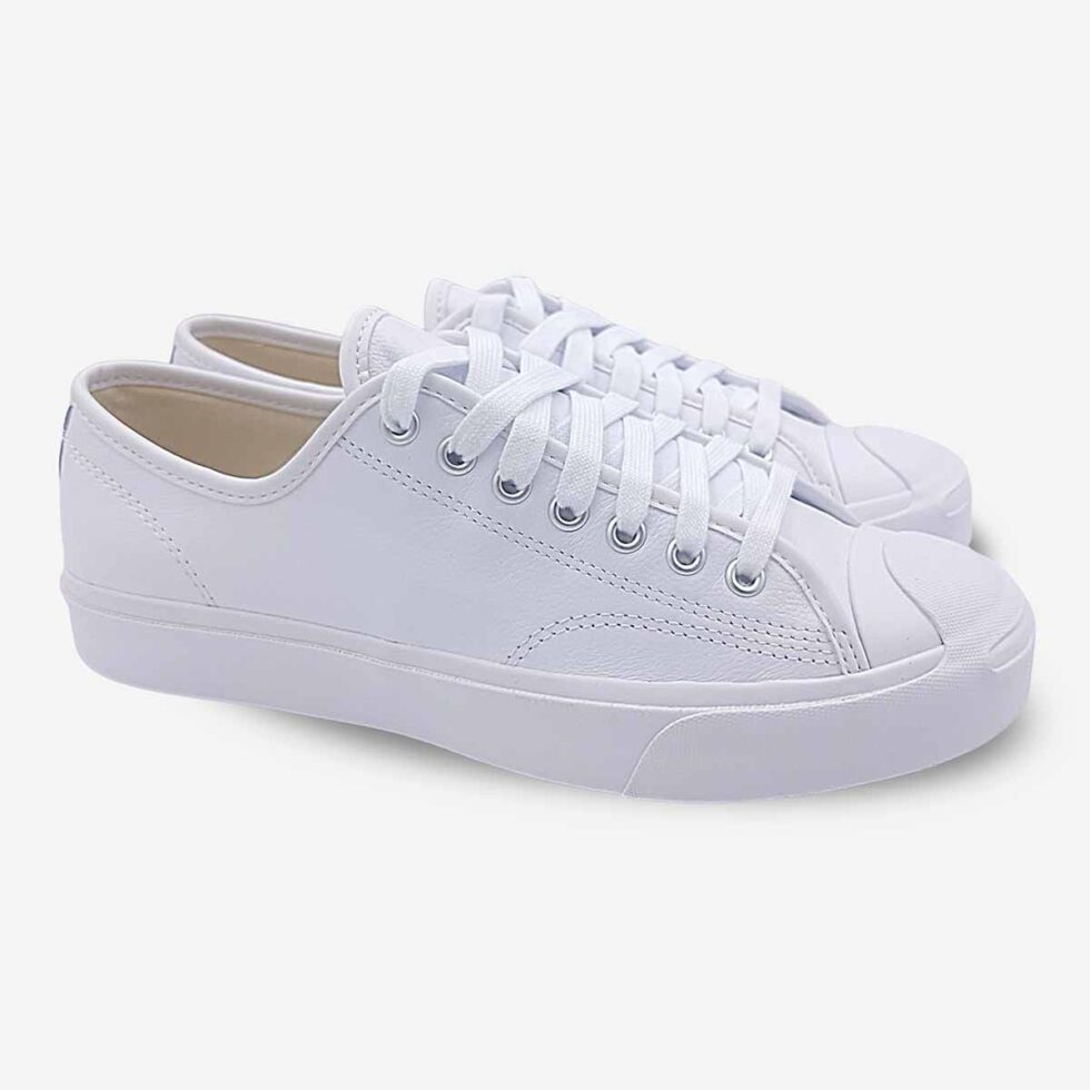 Angled pair of Jack Purcell low white leather sneakers with matching white sole