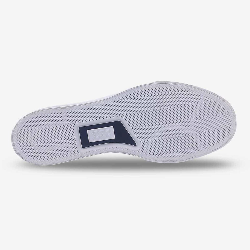 Underside view of Jack Purcell low white leather sneaker showing white rubber outsole