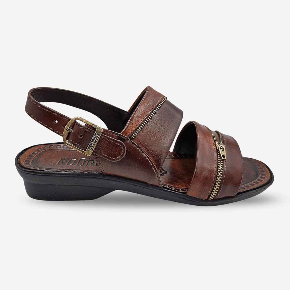Side Front View of Rodrigo Open-Toe Sandals in Taupe with wave straps featuring zip-pattern detailing.