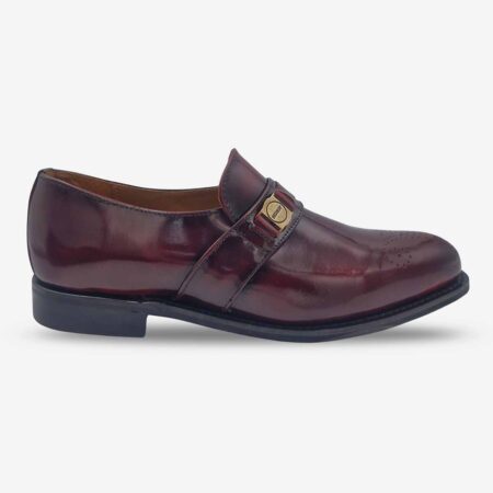 Side profile of Bishop Bit Loafer Shoes in burgundy leather with toe medallion.