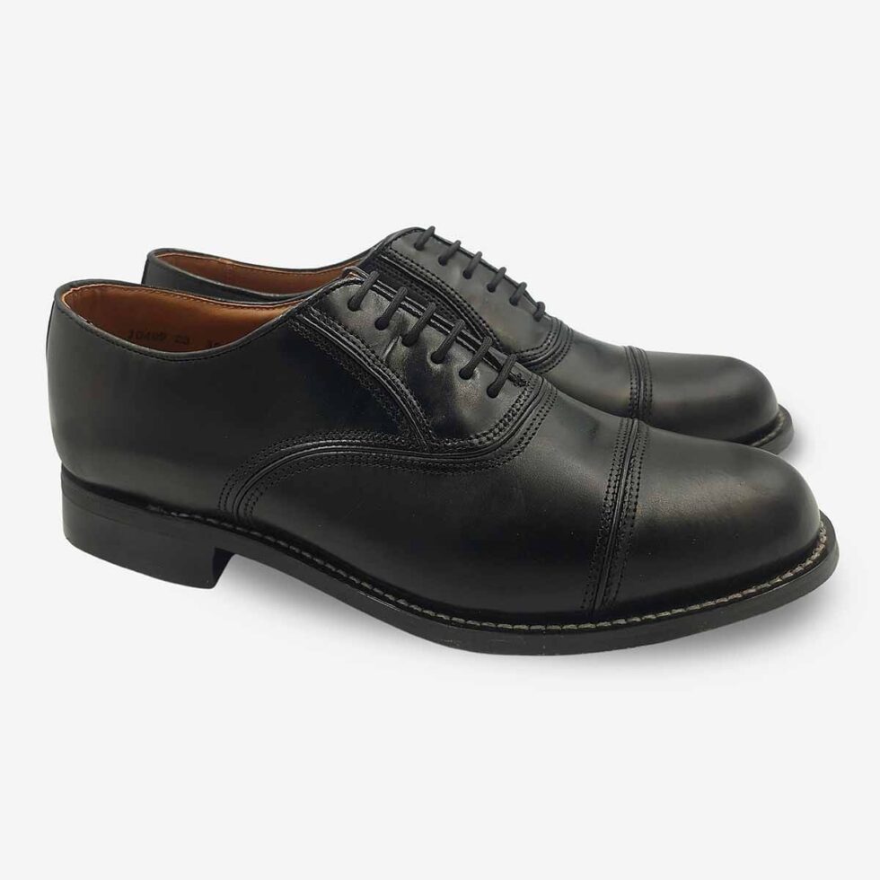 Angled pair view of Bishop Oxford shoes in black smooth leather with cap toe.