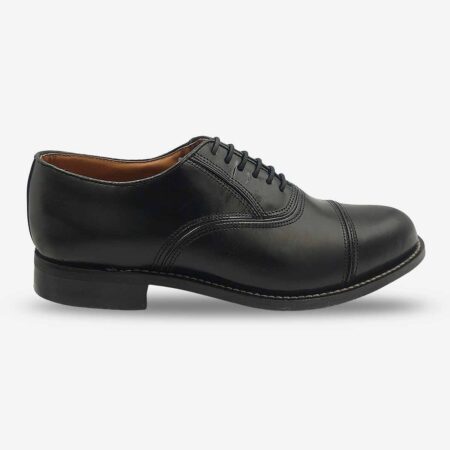Side front view of Bishop Oxford shoes in smooth black leather with cap toe.