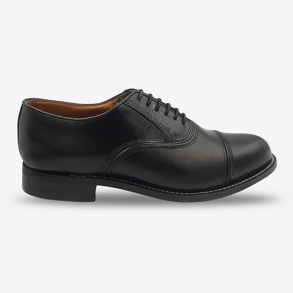 Side front view of Bishop Oxford shoes in smooth black leather with cap toe.