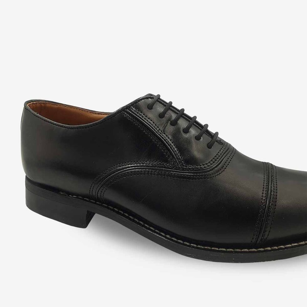Up close view of Bishop Oxford shoes in genuine smooth black leather with cap toe.