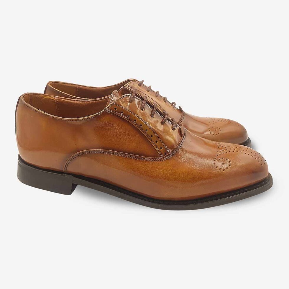 Angled pair of Bishop Tan Brown Oxford Shoes with toe medallion.