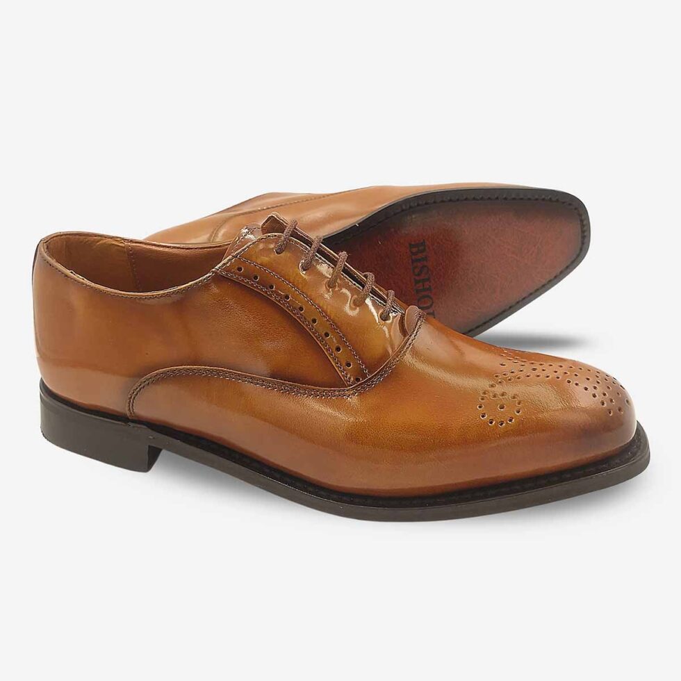 Angled sole view of Bishop Tan Brown Oxford Shoes with toe medallion.