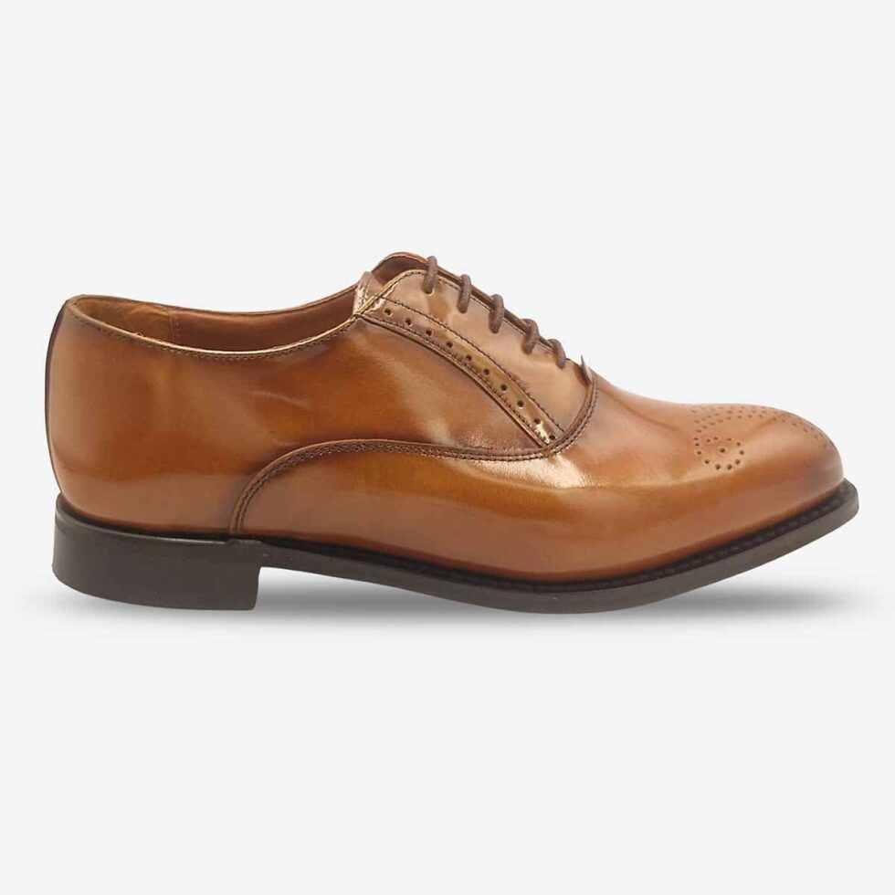 Side profile of Bishop Tan Brown Oxford Shoes highlighting toe medallion.