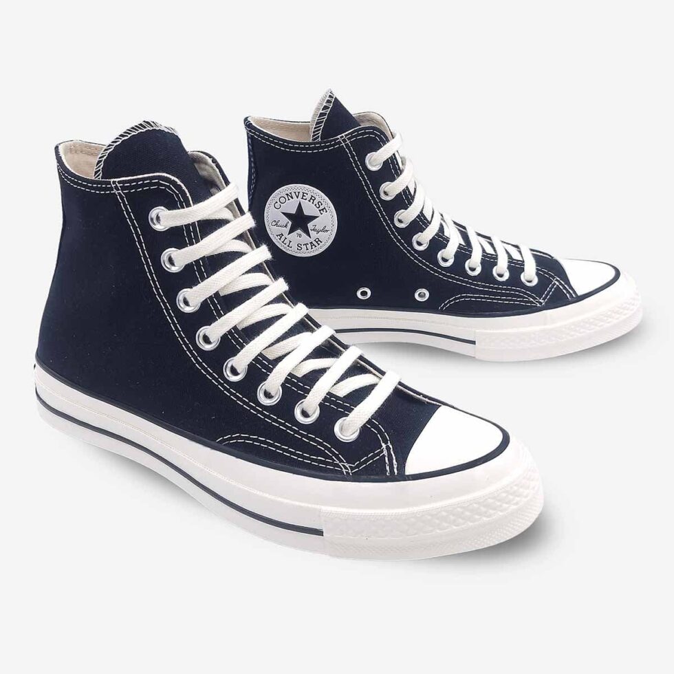 Angled pair of Converse Chuck 70 Black Boots with Chuck 70 ankle patch visible on inner side of left boot.
