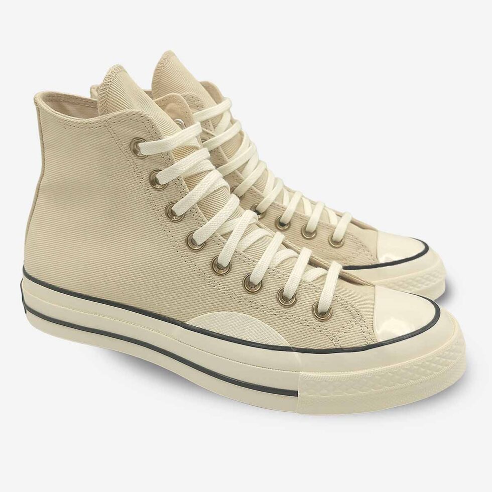 Angled pair of Converse Chuck 70 boots in cream white colour.