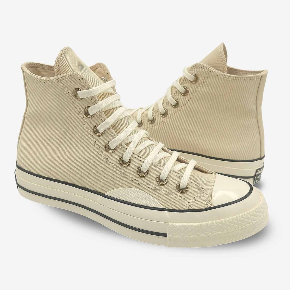 Mirrored pair of Converse Chuck 70 high-tops in cream white colour.