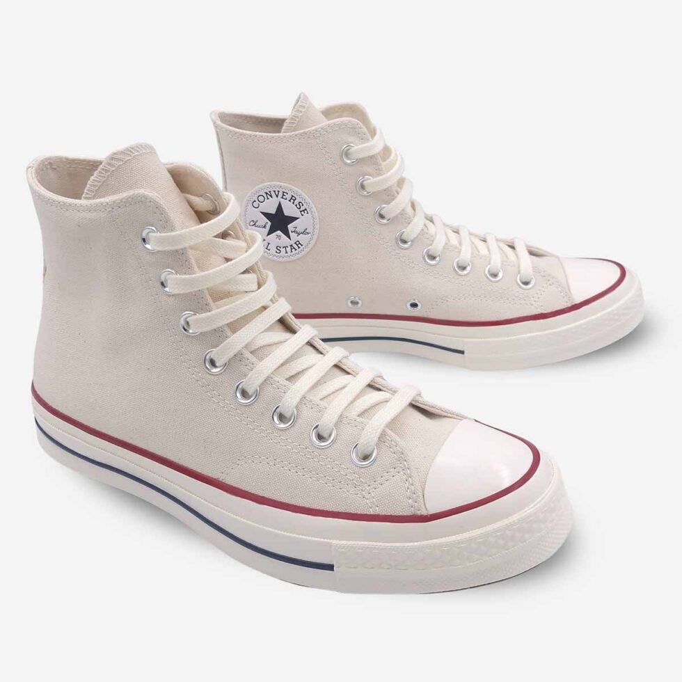 Angled pair of Converse Chuck 70 White Boots in Parchment showing Chuck 70 ankle patch on left boot.