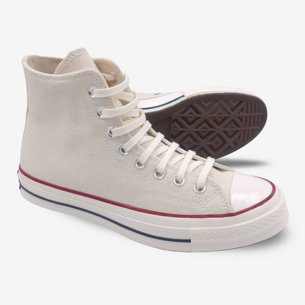 Angled pair showing sole of Converse Chuck 70 White Boots in Parchment colour.