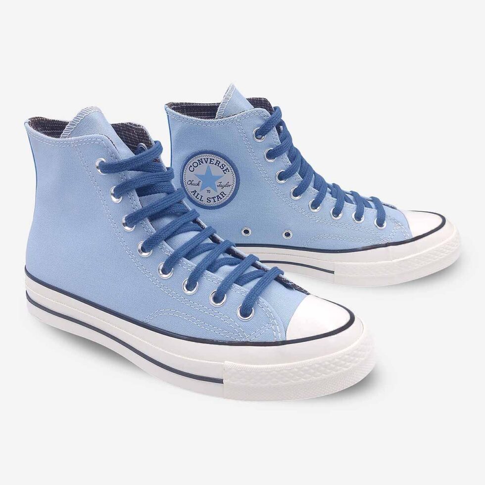 Angled pair showing Chuck Taylor ankle patch on left Converse Chuck 70 boots in sky blue colour.
