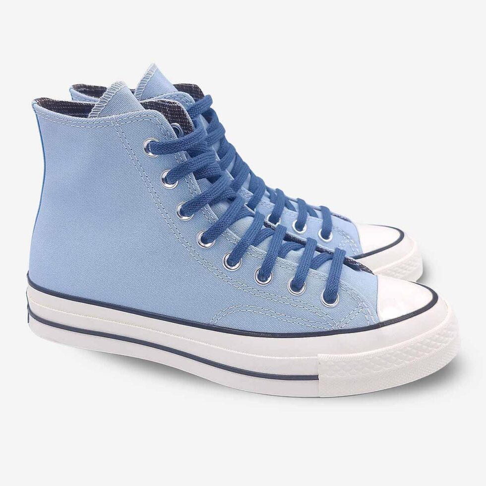 Angled pair of Converse Chuck 70 high-tops in sky blue colour showing contrast laces.