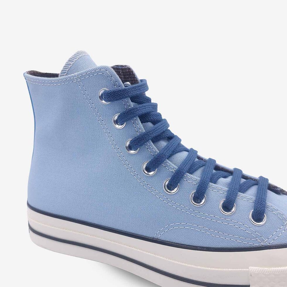 Close-up of Converse Chuck 70 high-top boots in sky blue colour with contrasting dark blue laces.